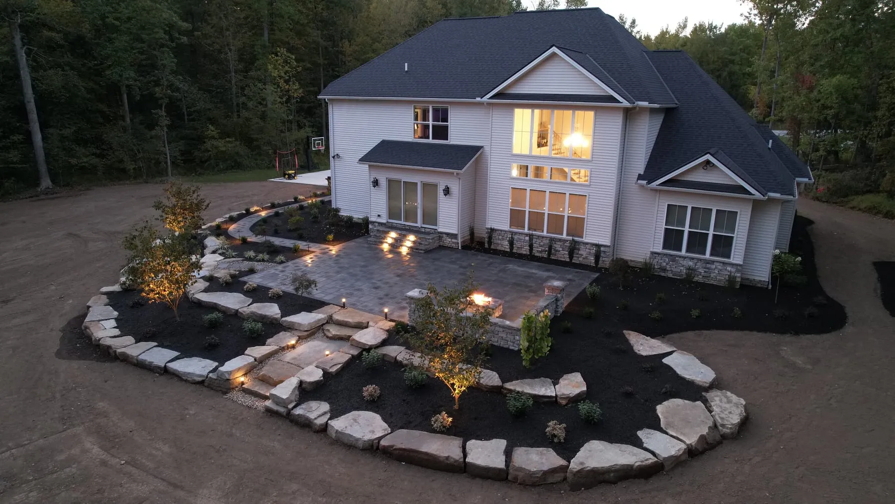 Landscaped Northeast Ohio property with lighting and irrigated lawn